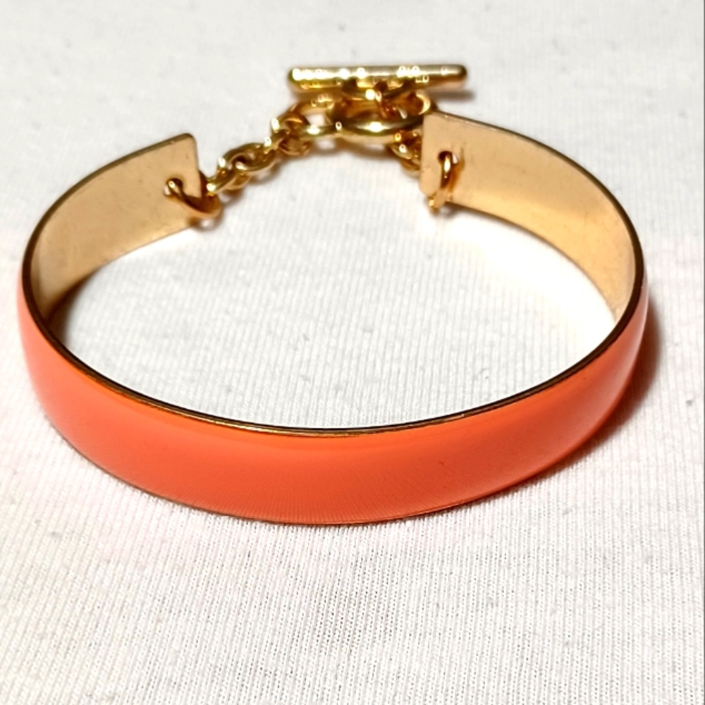 CORAL ENAMEL TOGGLE GOLD TONE BANGLE